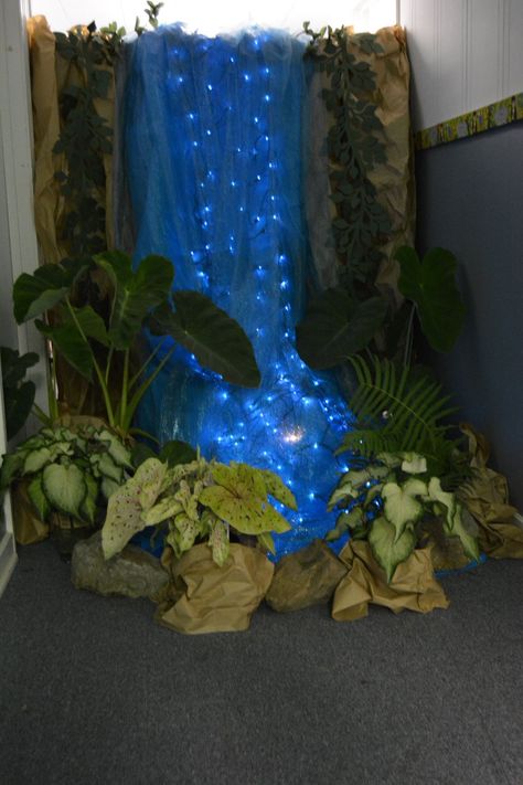 Waterfall at end of hallway. Hallway decorated as a rainforest. Fake Waterfall, End Of Hallway, Waterfall Decoration, Jungle Decorations, Vbs Themes, Deco Nature, Forest Theme, Jungle Party, Vacation Bible School