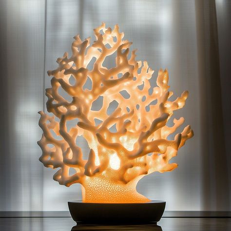 This coral-inspired lamp features a stunning design that captures the intricate beauty of underwater coral formations. The lamp’s base is crafted to resemble branching coral, with each delicate branch creating an organic, flowing silhouette. The soft, warm light diffuses through the carefully sculpted coral patterns, casting mesmerizing shadows that evoke the serene ambiance of an ocean reef. Ideal for adding a touch of nature to any space, this lamp blends artistry and functionality, making ... Coral Candle, Coral Candles, Material Studies, Coral Lamp, Light Bulb Crafts, Ceramic Pendant Light, Ocean Reef, Coral Pattern, Coral Design