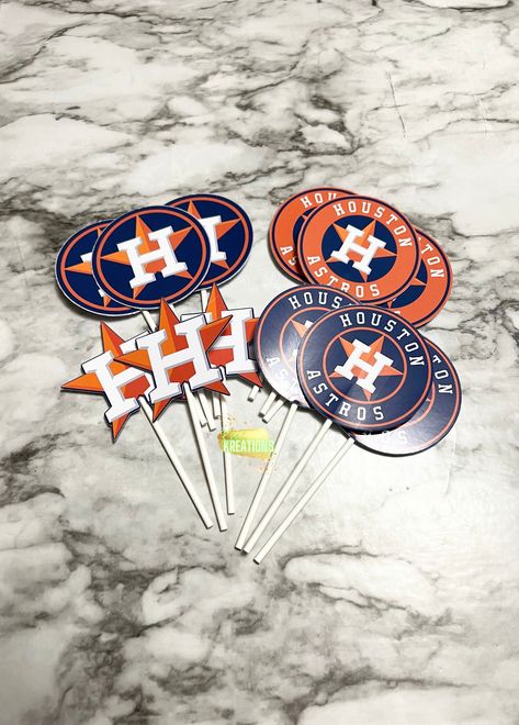 "1 dozen Houston Astros themed cupcake toppers. Each dozen comes with 4 different Houston Astro designs, 3 of each. The cut outs measures are 2.5\" in height and width and are on a 4 inch lollipop stick. Please see my shop announcement on the homepage to see when I am booked out for orders. NOTE: All copyrights and trademarks of the character images used belong to their respective owners and are not being sold. This listing is for my time and effort used to create and personalize the designs." Astros Christmas Tree, Astros Party, Baseball Cake, Lollipop Sticks, Black Christmas Trees, Christmas Tree Topper, Themed Cupcakes, Superbowl Party, Tree Topper