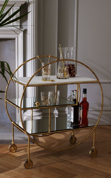 Oliver Bonas' gilt and marble Luxe Round Bamboo Trolley (£395) Bar Deco, Bandeja Bar, Gold Drinks, Gold Bar Cart, Bar Cart Styling, Drinks Trolley, Casa Vintage, Bar Cart Decor, Living Room Cabinets