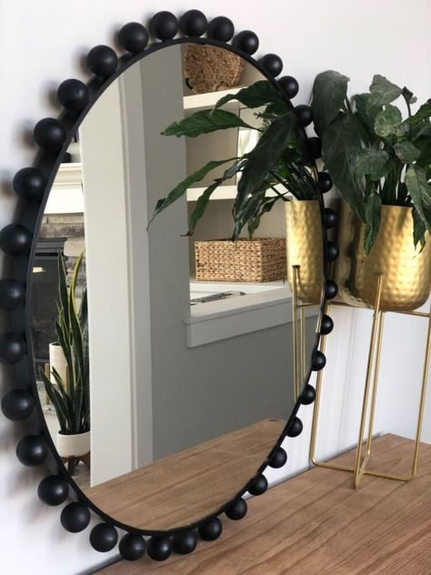 How to get a designer looking mirror for way less cost! I love love love the look of these mirrors but I was positive I could find a way cheaper way to make one on my own. so let’s do this! I started off with this mirror that I found for $58 I absolutely love the size of this one, honestly you can use any round mirror for this project. Next I found these wooden rounds (without holes) I have seen so many people using the wooden round balls with holes in the for projects but the… Diy Frame For Round Mirror, Round Beaded Mirror, How To Make A Round Mirror Frame, Round Mirror Wall Decor Ideas, Oval Wall Decor, Round Mirror Frame Diy, How To Decorate Your Mirror, Round Mirror Decor Ideas, Bead Wall Art