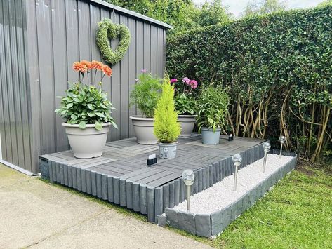 Garden Makeover Ideas On A Budget | Just made myself a little raised decking area with pallets and composite decking tiles for planting some flowers wanted to brighten up my garden never... | Facebook Garden Makeover Ideas, Raised Decking, Composite Deck Tiles, Decking Tiles, Raised Deck, Decking Area, Deck Tiles, Deck Tile, Garden Makeover