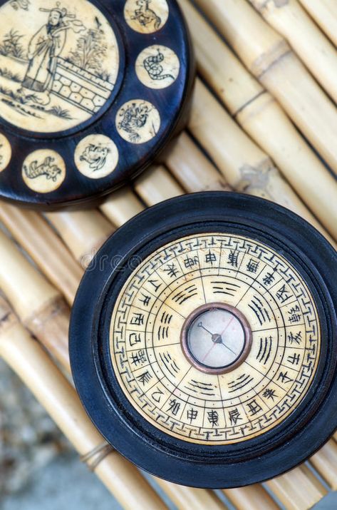 Chinese Astrology. Feng Shui compass on bamboo background showing ba gua wheel with trigrams and Chinese astrology animal signs engraved on ivory bone royalty free stock photo North Compass, Animal Signs, Bamboo Background, Zodiac Wheel, Astrology Stars, Chinese Astrology, Pole Star, Pet Signs, Zodiac Art