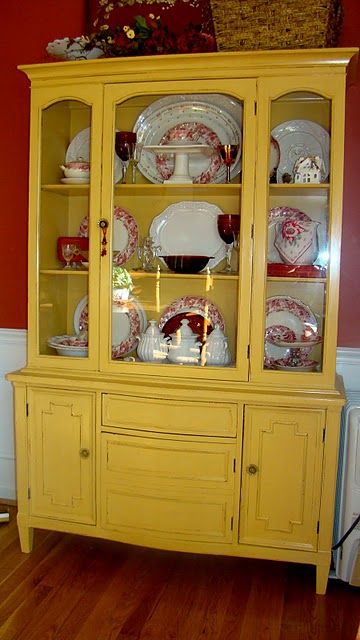 China cabinet makeover.  Try this in Chalk Paint, Arles, for a less glossy, more aged look. Yellow China Cabinet, China Cabinet Makeover, Painted China Cabinets, Glitter Houses, Cabinet Makeover, White Dishes, Diy Desk, Shabby Vintage, Paint Furniture