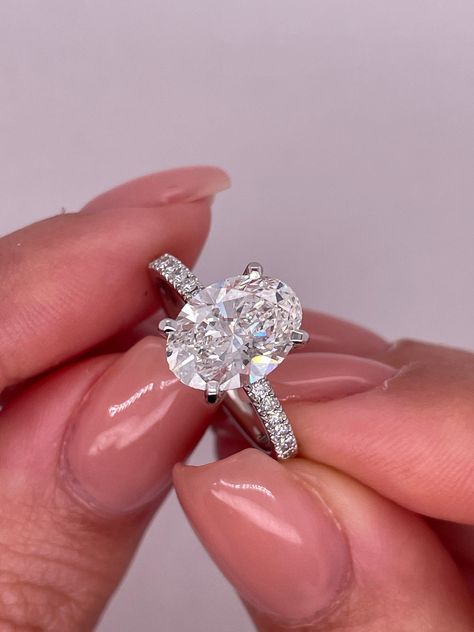 This is an amazing 1.75 carat oval lab grown diamond ring cvd this Engagement ring is 1.50 carat center stone  and 0.25 carat Dimond side  we offering FREE SHIPPING and 30 days returns  MAIN DIAMOND:1.50  diamond shape: oval certificate: igi color:e clarity: vs1 cut: excellent polish: excellent comments: lab grown diamond gold metal: 14k white ,yellow ,rose gold DIAMOND SIDE   0.25 carat  18 stones, each one 0.015 cart  1.5-1.6 mm d-e color vvs clarity lab grown diamonds we are here 24/7 to help Dimond Ring, Pave Engagement Ring, Rose Gold Diamonds, Diamond Shapes, Lab Grown Diamonds, Wedding Engagement, Gold Diamond, Diamond Jewelry, Ring Verlobung