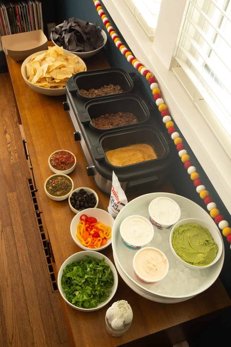 Looking for something fun to serve a crowd that takes just a few minutes to set up? A nacho bar is the perfect thing! I’ve served a DIY nacho bar for everything from a Halloween open house, to football watch parties, to birthdays. It’s a guaranteed crowd-pleaser that even kids like. 
#nachos #gameday #snacks #texmex Snack Bar For Party, Diy Nacho Bar, Halloween Open House, Nacho Bar Ideas, Bar For Party, Nacho Bar Party, Gameday Snacks, Backyard Movie Night Party, Nacho Party