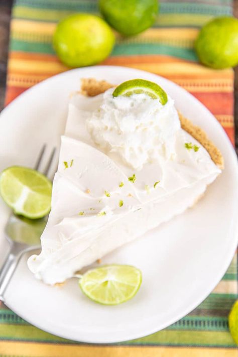 No-Bake Key Lime Pie Recipe– easy no-bake pie with a creamy, tangy, and tart key lime filling. Super quick to make with only 4 ingredients! Sweetened condensed milk, key lime juice, cool whip, and a graham cracker crust. Refrigerate until set. So refreshing and perfect for summer potlucks, cookouts, and parties. SO easy and SOOOO delicious! No Bake Sweetened Condensed Milk Recipes, Key Lime Pie Recipe Condensed Milk, Key Lime Pie With Condensed Milk, Limeade Pie Condensed Milk, Key Lime Pie Recipe Easy, No Bake Key Lime Pie Condensed Milk, Easy Key Lime Pie Recipe With Yogurt, Key Lime Pie Recipe No Bake, Pie Recipe Easy