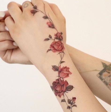 Rose Vine Hand Tattoo, Wrapping Flower Tattoo, Climbing Rose Tattoo, Mother Daughter Floral Tattoos, Rose Wrist Tattoo For Women, Rose Wrap Around Tattoo, Grace Tattoo Ideas, Unique Female Tattoos, Food Tattoo Ideas