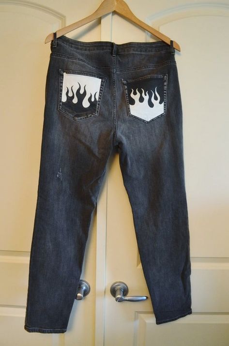 These Hand Painted ready to wear Denim Jeans have been customized with an original design in fabric Paints. The design has been Heat treated for durability, making it more suitable for everyday wear These Faded Black Jeans have a Fun Flaming pocket design on each back pocket and an open zipper on the front. Above each ripped knee are the words "care" and "less"These Jeans are a US size 10 or 30" waist Diy Pants, Painted Clothes Diy, Bling Jeans, Diy Jeans, Faded Black Jeans, Diy Vetement, Custom Jeans, Custom Denim, Painted Jeans