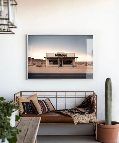 "This minimalistic desert landscape print, entitled \"Lou's Liquor\" is print #5 of 7 in our Roadside Remains Series! This wall decor is the perfect piece for any western, southwestern, or bohemian home. The simple design is great for a home bar or wine room, and the smaller format makes a great addition to a gallery wall. Our Roadside Remains Series posters make a great gift for the road tripper in your family as they're inspired by the long-forgotten places you'll see on a road trip west! *Ple Western Bohemian Decor, Western Minimalist Decor, Modern Western Home Decor Living Rooms, Simple Western Home Decor, Desert Aesthetic Decor, Modern Western Decor, Eclectic Bar, Wall Art For Men, Desert Landscape Art