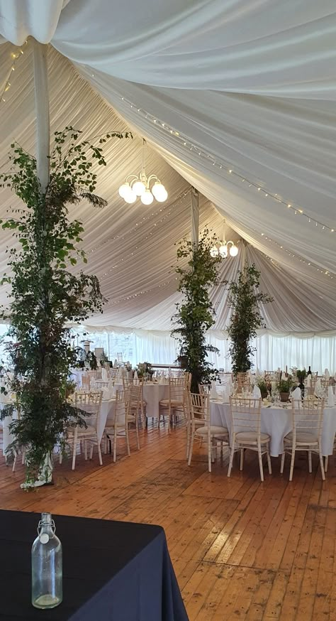 Marquee Installation // locally grown greenery attached to the marquee poles Marquee Pole Decoration, Marquee Greenery, Diy Wedding Marquee, Marquee Interior, Marquee Flowers, Marquee Wedding Decoration, Marquee Decor, Farm Wedding Decorations, Marquee Party