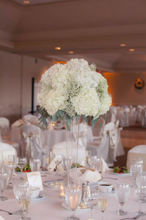 Tall White Hydrangea and Baby’s Breath Wedding Centerpiece Flowers in Clear Vase | White and Ivory Wedding | Tampa Wedding Floral Designer Northside Florist Flowers In Clear Vase, Hunter Wedding, Tall Wedding Centerpieces, Hydrangea Centerpiece, Golf Course Wedding, Hydrangeas Wedding, Clear Vase, Wedding Floral Centerpieces, Tall Centerpieces