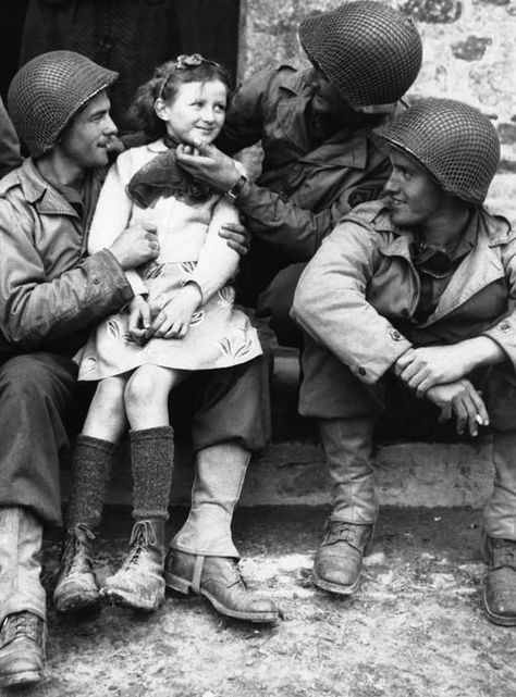 "A French girl finds three admirers from the ranks of American forces who have made a speedy and successful advance through Normandy, France on June 22, 1944. From left to right,Private Robert D. Furra, Private Willie Johnson and Private C.K. Jones." Herald Dispatch. History Lettering, History Instagram, Foto Cowgirl, Lee Miller, Strange History, British Soldier, Egyptian History, History Photos, American Soldiers