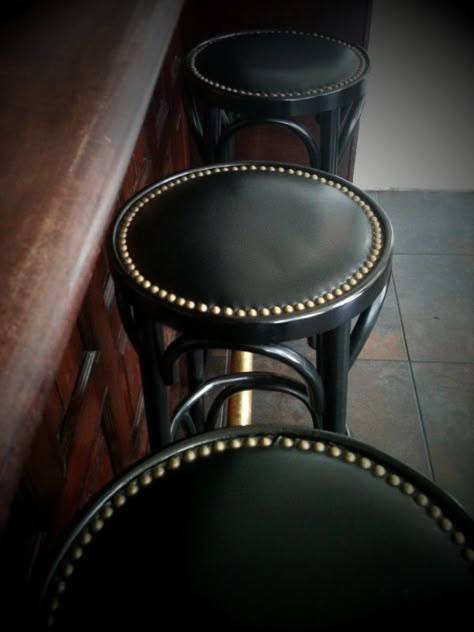 nailhead bar stool - simple painted bentwood stools with leather or pleather seats rimmed with nailheads - doable?  www.yournestdesign.blogspot.com Black Leather Bar Stools, Irish Village, Before After Furniture, Speakeasy Decor, Whiskey Room, English Pub, Speakeasy Bar, High Horse, Nightclub Design