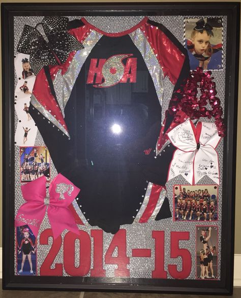 Cheer Shadow box - this was a great way to, not only display, but protect my daughters retired cheer uniforms. Cheer Uniform Shadow Box, Cheer Room Decor, Cheer Room, Gymnastics Room Decor, Sports Shadow Boxes, Cheer Box, Cheer Bows Diy, Cheer Banquet, Cheer Signs