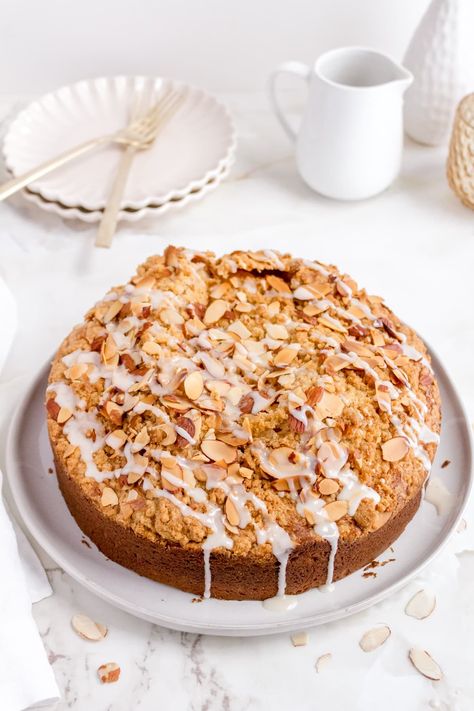 Our light and fluffy almond coffee cake is made with pure almond extract, sour cream and covered with sliced almonds and a homemade cinnamon streusel. This is truly one of the best coffee cakes that you will ever make. This sweet almond coffee cake is perfect for a lazy weekend morning, a special occasion and the perfect recipe for your next brunch or afternoon tea. | almond streusel coffee cake recipe | almond coffee cake recipes Coffee Almond Cake, Cake Recipes Almond, Fall Coffee Cake, Best Coffee Cake Recipes, Filled Coffee Cake, Almond Coffee Cake Recipes, Streusel Recipe, Homemade Coffee Cake, Cake Almond