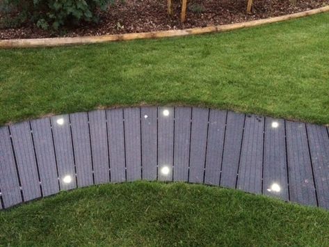 Cladco Composite Decking doesn't have to be used in straight lines, it can be used to create pathways or bridges. As this customer has, you can even add lights in to create a feature or safety aspect when it gets dark. Composite Decking Pathway, Composite Walkway Pathways, Decking Path, Led Patio Lights, Wooden Pathway, Wood Walkway, Decking Ideas, Walkway Lighting, Garden Seating Area