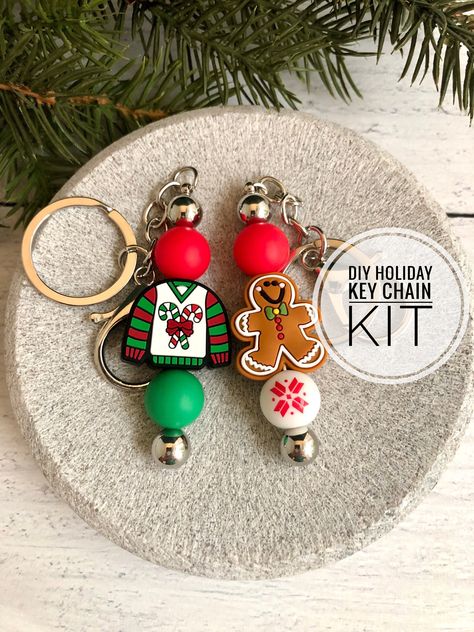 Make your OWN cute holiday keychains with this handy kit! Everything you need is packaged for you! This project is EASY for kids and adults! This Christmas Key Chain Kit will allow you to make 2 keychains: "The Ugly Sweater" and "Gingerbread Man."  The kit contains: - Two silver beadable key chains - Two silicone focal beads (one Ugly Sweater and one Gingerbread Man) - 4 additional silicone beads All you have to do is unscrew the ball end of the rod on each key chain, slide the beads on, and rep Holiday Keychains, Keychain Crafts, Christmas Key, Keychain Craft, Bogg Bag, Beaded Pens, Diy For Men, Christmas Tree Crafts, Beadable Products