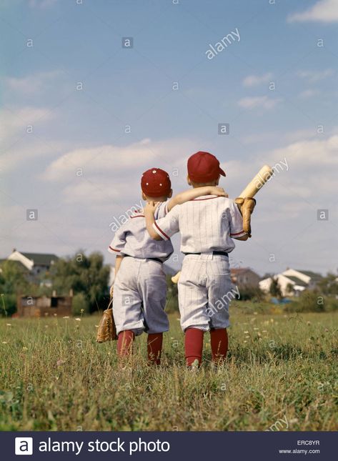 Download this stock image: 1960s TWO BOYS BROTHERS TEAMMATES WEARING LITTLE LEAGUE BASEBALL UNIFORMS WALKING ARM IN ARM AWAY FROM CAMERA - ERC8YR from Alamy's library of millions of high resolution stock photos, illustrations and vectors./ Little League Baseball Pictures, Baseball Photoshoot, Baseball Drawings, Baseball Kids, Baseball Photography, Baseball Christmas, Fall Ball, Little League Baseball, Baseball Pictures