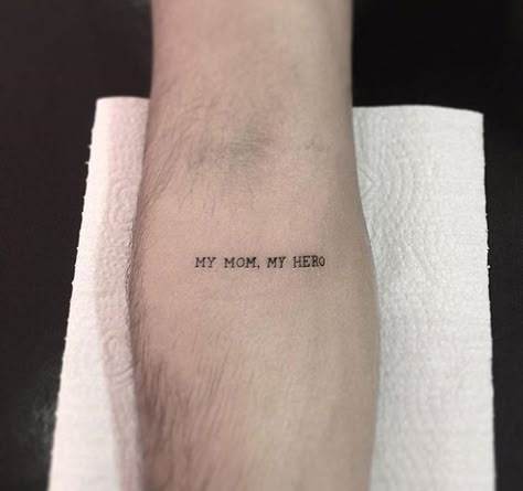 "My Mom, My Hero" quote tattoo on the arm | www.otzi.app My Dad My Hero Tattoo, 1999 Tattoo, Tatuagem Masculina Pequena, Quote Tattoos Girls, Small Chest Tattoos, Elbow Tattoos, Inspiration Tattoos, Mother Tattoos, Small Tattoos Simple