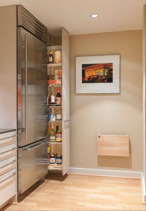 Drawers and pullout pantries, like the one at right, make the most of awkward spaces. They allow easy access to the back of the storage area. Modern Kitchen Pantry, Professional Kitchen Design, Model Dapur, Hidden Pantry, Space Saving Kitchen, Interior Remodel, Kitchen Pantry Cabinets, Pantry Design, Remodel Bedroom