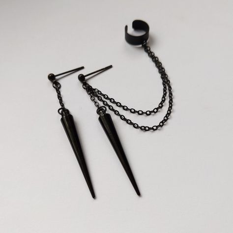 Black ear cuff earrings, Spike ear cuff earrings All elements are black plated brass +acrylic spikes The chains measure 6cm/2.3" and 7cm/2.7". If you prefer different length of the chains, or just 1 chain for the cuff, please leave a note at checkout. Spike size: 3.3cm/1.29"( including ring) If you have any questions please contact me. For more shipping info see "Shipping&Policies"! Chain Cuff Earrings, Black Ear Cuff, Spike Ear Cuff, Earring Cuff Chain, Spike Ring, Ear Cuff Earrings, Cool Piercings, Earrings Chain, Wrap Earrings