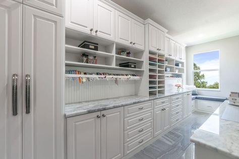 This large crafting room features a wrapping station with organizers for ribbons and supplies. Paper Shelves, Craft Cabinets, Kitchen Craft Cabinets, Scrapbook Rooms, Closet Factory, Craft Room Furniture, Sewing Room Design, Dream Craft Room, Kitchen Craft