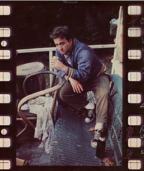 Production image of John Belushi relaxing between sessions of Animal House, Eugene, OR 1978. John Belushi Animal House, John Belushi, Blues Brothers, Charlie Chaplin, Animal House, Comedians, Style Icons, Historical Figures, Fictional Characters