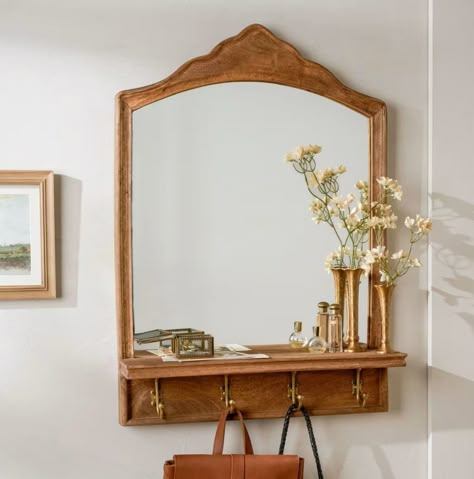 Weathered wood meets brass-finished accents in our James mirror. Making any room feel elevated and open, this decorative mirror features a durable shelf and hook rack for catching totes and coats in the entryway, mudroom, or any room that needs extra space. Hangs with a French cleat (included). Mirror And Key Holder Entryway, Arched Brass Mirror, First Home Ideas Decor Cheap, Mirror And Clothes Rack, Mirror With Plates On Wall, Cottage Mirror Ideas, Hook Decorating Ideas, Vintage Standing Mirror Aesthetic, Entryway With Hooks And Mirror