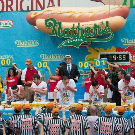 Hot dog eating is a serious Fourth of July sport. The Super Bowl of competitive eating begins this week, hosted by Nathan’s Famous Hot Dogs on Coney Island – a tradition proudly held since 1916. The contest, however, is only one of many competitive eating events that the Major League Eating body – yes, a real council! – supervises year-round. Other cutthroat traditions include the Deep-Fried Asparagus Eating Championship in Stockton, the Cannoli Eating Competition in New York's Little Italy,... Hot Dog Eating Contest, Competitive Eating, Fried Asparagus, Food Competition, Asparagus Fries, Little Italy, Coney Island, Cannoli, Dog Eating