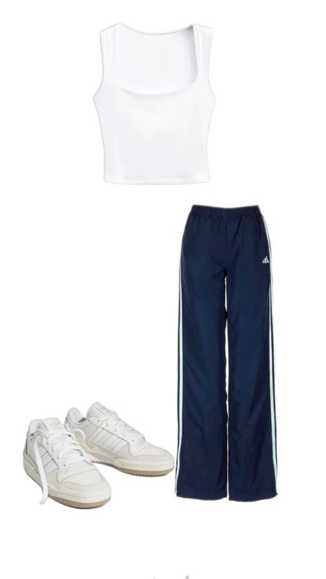 Embrace the sporty chic vibe with this effortlessly cool outfit! Navy Adidas track pants offer a comfortable yet stylish fit, paired with a simple white crop tank for a fresh, clean look. Complete the outfit with crisp white Adidas Forums to tie it all together. Perfect for running errands, lounging, or casual outings, this ensemble combines athletic wear with street style for the ultimate laid-back yet trendy look. #SportyChic #AdidasTrackPants #CropTank #AdidasForums #StreetStyle #Athleisure #CasualOutfit #OOTD Adidas Forums, Adidas Track Pants Outfit, Adidas Pants Outfit, Outfit Navy, Track Pants Outfit, Navy Adidas, White Crop Tank, Cool Outfit, Adidas Track Pants