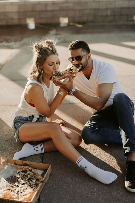 Kristen & Bally having fun with their engagement session while enjoying their favorite pizza. Pizza Date Night Photoshoot, Engagement Photos Funny Creative, Engagement Photos Eating Pizza, Rooftop Valentines Day Photoshoot, Pizza And Beer Photoshoot, Pizza Rooftop Photoshoot, Pizza And Beer Couples Photography, Engagement Photos With Pizza, Fun Anniversary Photo Shoot