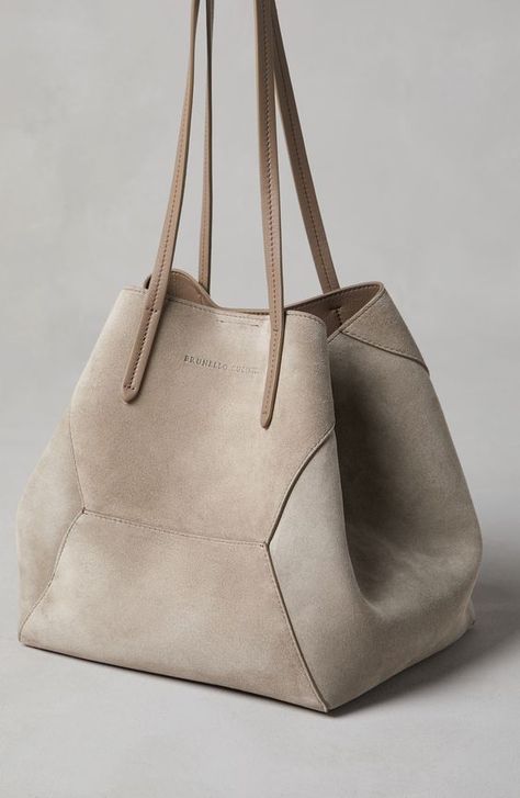 The refined suede is a compact leather with a soft, velvety texture. A leather lining completes the look of the bag. Magnetic snap closure Double handle Leather lining Detachable internal pochette with zipper Nickel-free monili decoration Bag is 47 cm (18,50") long, 20 cm (7,87") wide and 26 cm (10,24") high Fashion And Beauty Tips, Trending Handbag, Mens Eyewear, Bag Light, Eyewear Womens, Shopper Bag, Everyday Bag, Stylish Bag, Brunello Cucinelli