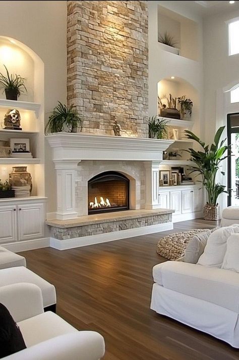 High Ceiling Living Room Shelves, Shiplap Wall Next To Fireplace, Fireplace Tv Shelves, Focal Wall With Fireplace, Fireplace With Wood Storage On One Side, Family Room Stone Fireplace, Raised Hearth Fireplace With Built Ins, Living Rooms With Stone Fireplaces, Built In Shelves Living Room Stone Fireplace