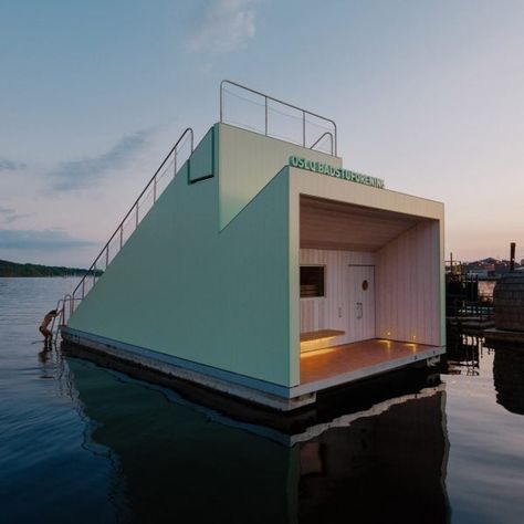 Estudio Herreros has completed a floating sauna on the Oslo Fjord in Norway, which has been clad with green-toned, recycled aluminium produced by Hydro. Floating Sauna, Dezeen Architecture, Oslo Fjord, Japanese Sliding Doors, Norwegian Architecture, Water Architecture, Norway Fjords, Thermal Bath, Log Burner