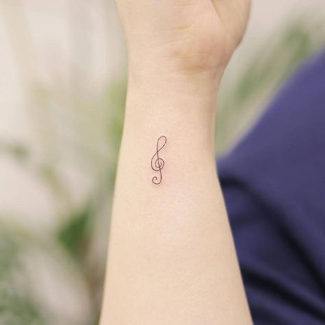 Minimalist treble clef tattoo on the wrist G Clef Tattoo, Nashville Tattoos, Clef Tattoo, Nashville Tattoo, Tattoo On The Wrist, Treble Clef Tattoo, Button Tags, Minimalist Line Art, Minimalist Tattoos