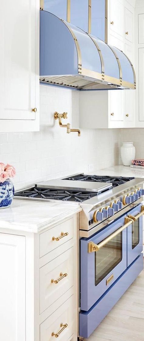 This stunning white kitchen gets a bold and beautiful pop of color with the BlueStar range and hood. With over 1,000 color options and a variety of trim selections you can make your appliances the highlight of your kitchen. Design boldly with 1,000 color options to fit your personal style. Start building your dream BlueStar now on their interactive Build Your Own tool. #dreamkitchen #kitchen #kitchendesign #smeg #kitchenlove #kitchenappliances #kitchenideas Cottage Kitchen Design, Colorful Kitchen Decor, Small Cottage Kitchen, Cottage Style Kitchen, Kitchen Design Trends, Small Cottage, Farmhouse Style Kitchen, Cottage Kitchen, Custom Kitchen