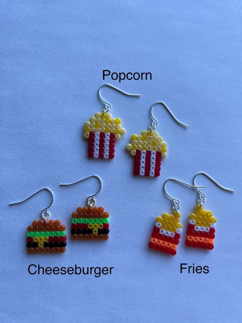 Some of your favourite foods made wearable!  Made with 2.6mm fuse beads on a silver ear wire. Melted Bead Earrings, Melty Beads Earrings, Perler Earing Ideas, Peeler Bead Earring Ideas, Melty Bead Earrings, Fuse Beads Earrings, Perler Beads Earrings Ideas, Perler Bead Crafts To Sell, Food Perler Bead Patterns