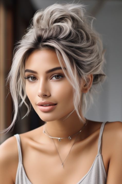 A silver messy bun is a laid-back, chic style perfect for everyday wear. This simple updo lets your silver color shine while offering a casual, effortless vibe. Click here to check out more stunning silver hair color ideas for 2023. Pelo Bob Ondulado, Hair Color Ideas For 2023, Silver Hair Color Ideas, Braids Blonde, Silver Blonde Hair, Grey Hair Inspiration, Silver Hair Color, Silver Grey Hair, Silver Blonde