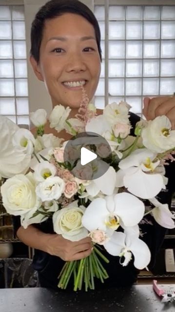 NYC Wedding and Events Florist on Instagram: "We made a gorgeous white bridal bouquet for a lovely and gorgeous wedding. See how the phalaenopsis orchid is incorporated in the end!  Ingredients use: Playa blanca rose, tibet rose, ranunculus, spray rose majolika, lisianthus piccolo and alissa, phalaenopsis orchid, anthurium, astilbe, champagne tinted plumosa, and pistachio foliage.  #bridalbouquet #handtiedbouquet #flowerarrangementclass" Phalaenopsis Orchid Bouquet, Tibet Rose, Bridal Bouquet Orchids, Orchid Bridal Bouquets, Orchid Bouquet, Hand Tied Bouquet, White Bridal Bouquet, Phalaenopsis Orchid, Spray Roses