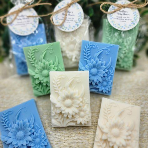 Our wildflower soap favors are the perfect addition to any baby shower or bridal shower.  Each soap is individually wrapped in a cellophane bag and tied with twine, making them a beautiful and elegant gift for your guests.  The soaps are delicately scented with the fragrance that you choose, creating a refreshing and relaxing sensory experience. The intricate rose designs are carefully crafted and colored, bringing a touch of whimsy and beauty to these handmade favors.  These soap favors not onl Baby In Bloom Shower Decorations, Baby Shower Soap Favors, Gift For Guests, Handmade Favors, Wildflower Baby Shower, Baby In Bloom, Wedding Shower Favors, Shower Soap, Soap Favors