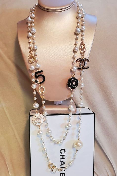 Price- 145.00 Only one!
Classic Necklace two row White faux Pearls, length- 37". Chanel logo size- 29 mm, two Camellia and cute N 5 )  
#Chanelgirl #Chanel #cocochanel #chanel #ribbon#gift#necklace#gift Chanel Ribbon, Cc Necklace, Ribbon Gift, Chanel Logo, Classic Necklace, Perfect Life, Coco Chanel, Necklace Gift, Gift Necklace