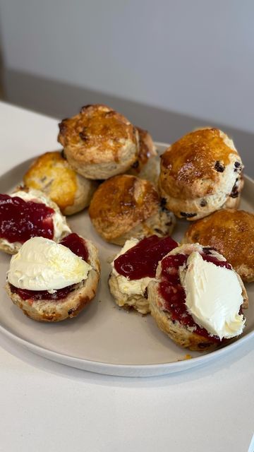 Jon Watts on Instagram: "Classic Scones 😍 Perfect for celebrating the Kings Coronation 👑 but the question is… how do you eat them, with the JAM or the CREAM first??!! Here’s what you need to make these: 400 g Self raising flour 1 tsp Baking powder 100 g Butter cubed 100 g Golden caster sugar 150 g Sultanas 1 Lemon 180 ml Milk 2 tsps Vanilla extract 2 Egg yolks To serve: Clotted cream Strawberry or Raspberry jam Check out my website for the full written recipe 🙌 Have a go, and let me know how you get on! ❤️🇬🇧 #recipe #scones #coronation" Classic Scones, Kings Coronation, Devon Cornwall, Self Raising Flour, Egg Yolks, Did You Eat, Clotted Cream, Bank Holiday Weekend, Raspberry Jam