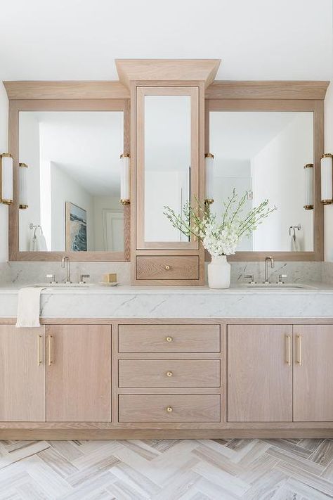 Fixed against a white and gray herringbone floor, a light brown brushed oak bath vanity is adorned with brass pulls and a marble countertop. Oak Vanity Bathroom, Oak Bathroom Vanity, Oak Bathroom, Bathroom Redesign, Transitional Bathroom, Herringbone Floor, Master Bath Remodel, Bathroom Redo, Bathroom Renos