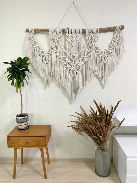 Looking for creative and stylish ways to incorporate macrame into your home decor? Check out these macrame wall hanging ideas that are perfect for adding a boho touch to any room in your home! From simple and minimalist designs to more intricate and detailed pieces, these macrame wall hangings are sure to impress. Whether you're looking to add texture and visual interest to a blank wall, or want to create a cozy and inviting atmosphere in your bedroom or living room. Large Macrame Wall Hanging Pattern, Big Macrame Wall Hanging, Wide Macrame Wall Hanging, Medium Macrame Wall Hanging, Macrame Wall Hanging Ideas, Extra Large Macrame Wall Hanging, Macrame Wall Hanging Large, Wall Hanging Ideas, Macrame Wall Hanging Tutorial