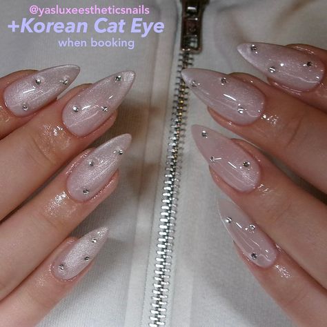 Who’s obsessed with this moonlight cat eye ?? 🌝✨ 🙂‍↕️🙂‍↕️🙂‍↕️🙂‍↕️ elevate any color or use alone by adding on Korean cat eye after selecting your nail service to amp up your look with a shy yet eye catching vibe! 🥰 #gelxhouston #houstonnailtech #houstonnailartist #houstonnails Almond Shape Cat Eye Nails, Cat Eye Nails With Gems, Cateye Almond Nails, Moonlight Cat Eye Nails, Cat Eye Nails With Charms, Cat Eye Glass Nails, Nail Design Cat Eye, Cat Eye White Nails, Crystal Cat Eye Nails