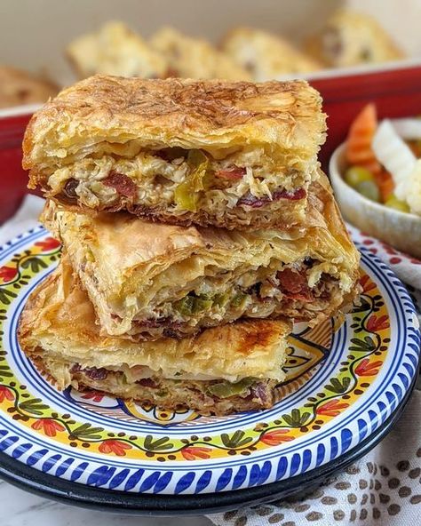 hind 🇪🇬🇺🇸 on Instagram‎: "egyptian goulash with cheese and basterma 🇪🇬 egyptian goulash is a baked phyllo pastry that’s often filled with ground meat, cheese or vegetables and coated in a milk-egg wash, which gives it a soft texture while maintaining the crispy layers. i previously shared my spiced beef goulash but this one is a game changer! stuffed with a mix of cheeses, basterma, peppers and olives, this goulash is so delicious and a great way to change it up. it’s reminiscent of middle Egyptian Goulash, Ground Beef Peppers, Side Foods, Phyllo Pastry, Beef Goulash, Spiced Beef, Egyptian Food, White Cheese, Phyllo Dough