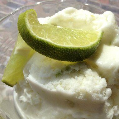 Coconut Lime Ice Cream - Automatic Ice Cream Maker Recipe Recipe | Allrecipes Ice Cream Maker Recipe, Mango Slices, Lime Ice Cream, Lime Sherbet, Ice Cream Maker Recipes, Fried Ice Cream, Coconut Ice Cream, Flavor Ice, Unsweetened Coconut Milk