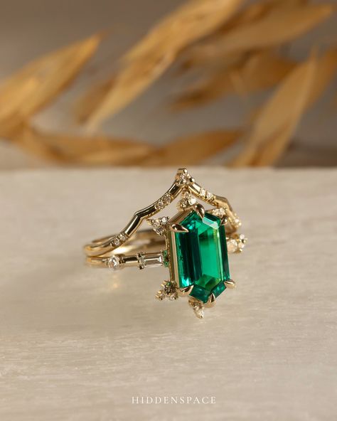 A Spark of Romance... ✨ Let the deep green of our Emerald Queen of Ice Ring sweep you off your feet, beautifully paired with the delicate glow of the Little Tiara Band. 💚👑 ✨ 15% OFF all our treasures until 12 AM Today! #Hiddenspacejewelry #emeraldengagementring #engagamentringstack #weddingringstack #ringstackinspo #14kyellowgoldring #14kyellowgold Emerald And Gold Engagement Ring, Fantasy Wedding Rings, Ice Ring, Dream Wedding Ring, Emerald Rings, Green Rings, Gold Aesthetic, Fantasy Wedding, Emerald Engagement Ring