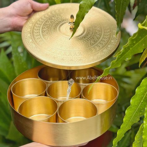 Introducing our latest collection of brass kitchenware that marries elegance with utility. From shimmering pans and saucepans to sleek stockpots, canisters, and spice boxes—every piece promises to enhance your culinary creations and beautify your kitchen space. Get ready to elevate your cooking experience with our handcrafted brass essentials. . . . #BrassKitchenware #CulinaryExcellence #HandcraftedCookware #KitchenDecor #NewLaunch #atmanirbhar #vocalforlocalindia #proudlymadeinindia Brass Kitchenware, Brass Thali Set, Brass Utensils India Kitchens, Brass Deepam, Indian Spice Box, Brass Urli Bowl, Brass Puja Items, Ancient Indian Art, Saucepans